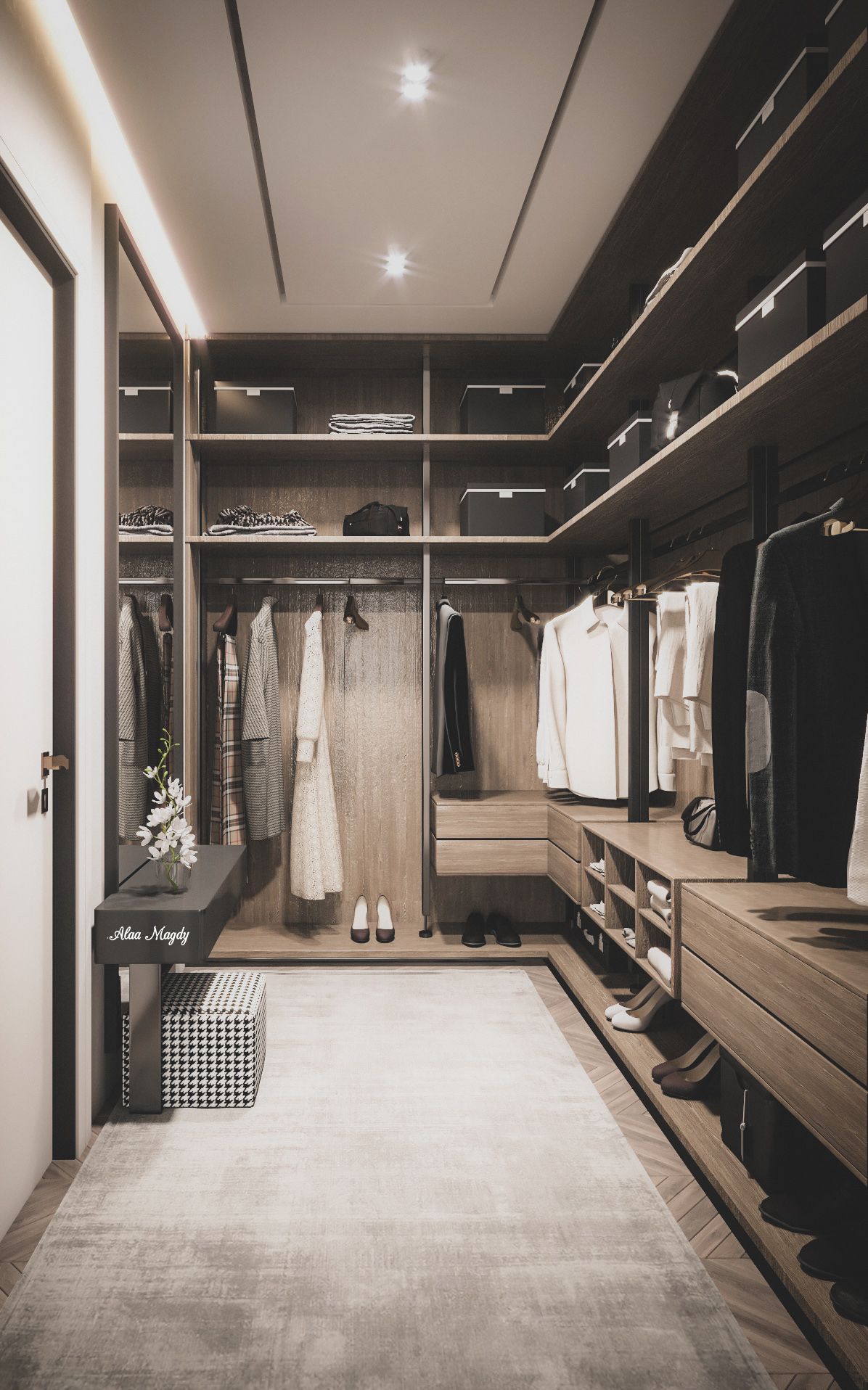 Luxurious dark wood walk-in closet with warm lighting and central rug | Al Janah Al Malaky