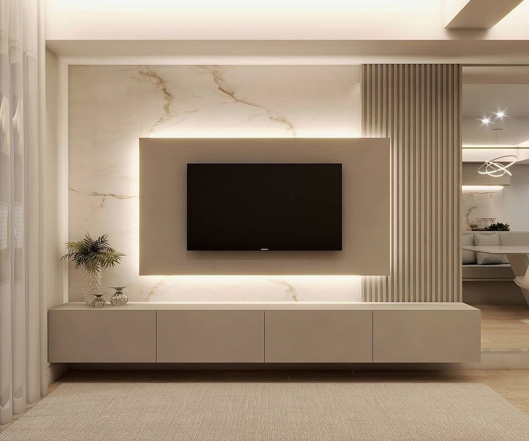 Floating media console with TV mounted on a luxurious backlit marble and slat wall | Al Janah Al Malaky