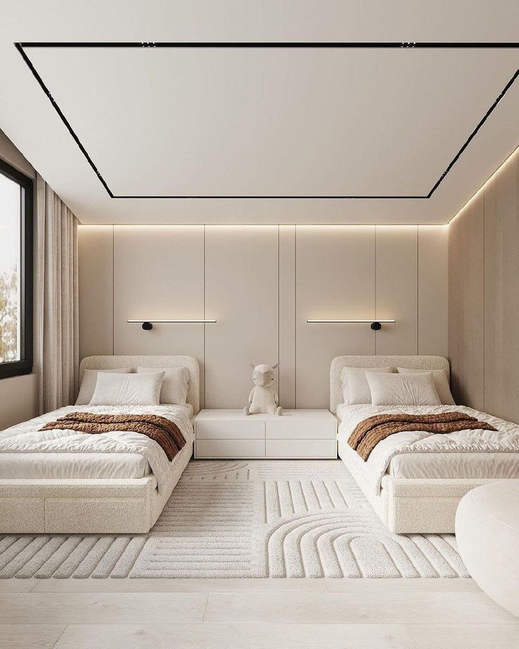Symmetrical modern twin bedroom with neutral tones, white beds, and abstract area rug | Al Janah Al Malaky