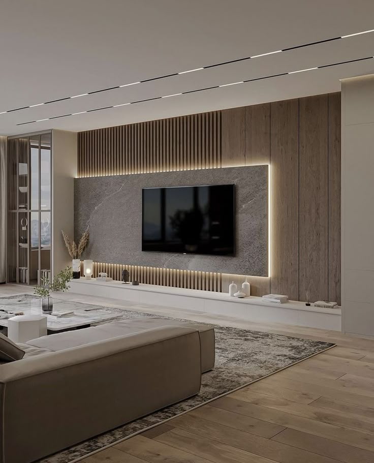 Luxurious modern living room featuring a wood and stone media wall with accent lighting | Al Janah Al Malaky