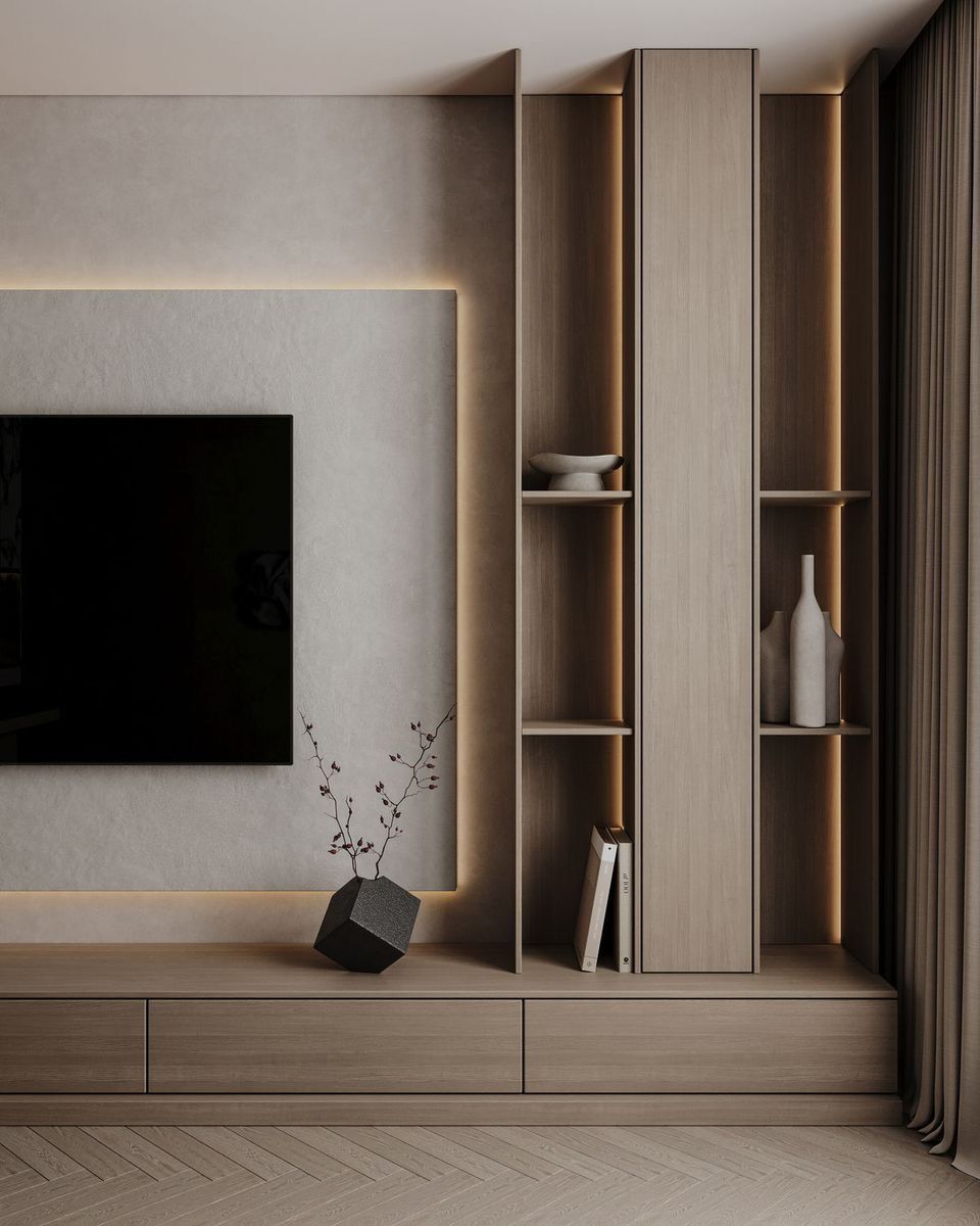Minimalist media wall with integrated wood shelving, recessed lighting, and large television | Al Janah Al Malaky