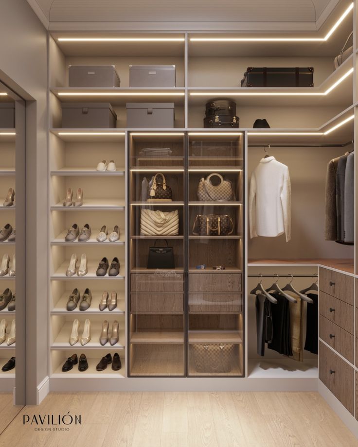 Luxury walk-in closet with illuminated shoe shelves and glass display cabinets | Al Janah Al Malaky