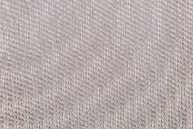 Close-up of a woven, beige fabric texture with subtle vertical stripes | Al Janah Al Malaky