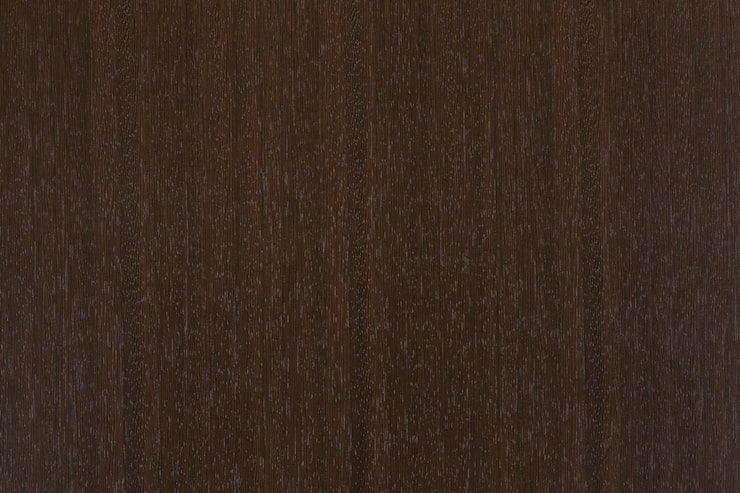 Dark brown wenge wood texture with a visible natural grain | Al Janah Al Malaky