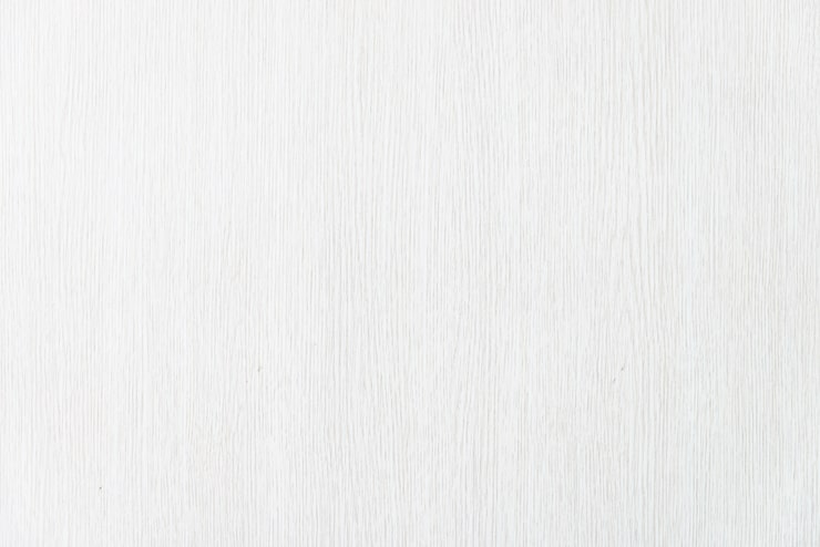 White wood texture background with subtle vertical grain | Al Janah Al Malaky